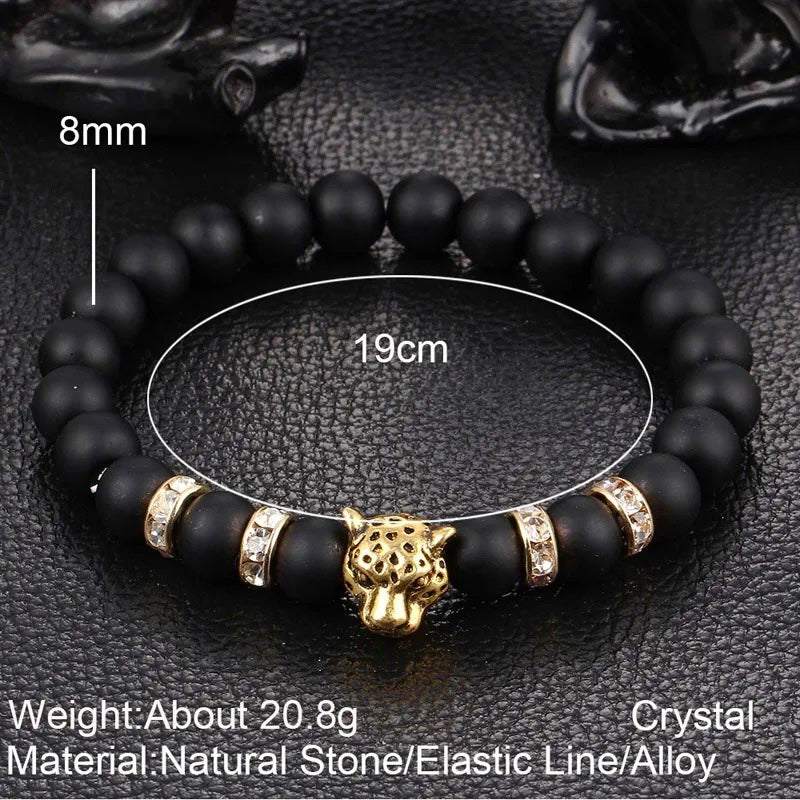 "Wild Elegance: Matte Black Onyx Bead Bracelet with Gold Accents, Rhinestone Rings, and Leopard Centerpiece"