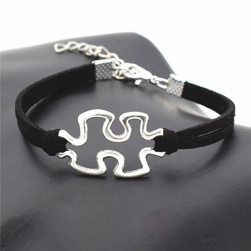 "Puzzle of Love: Autism Awareness Rope Bracelet with Interconnecting Puzzle Piece Charm"